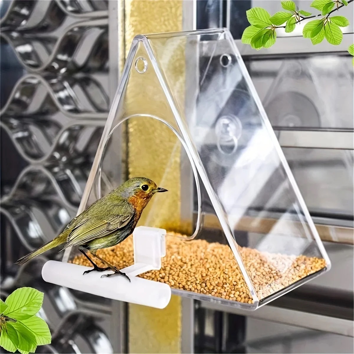 Clear window bird feeder with a small bird perched on it