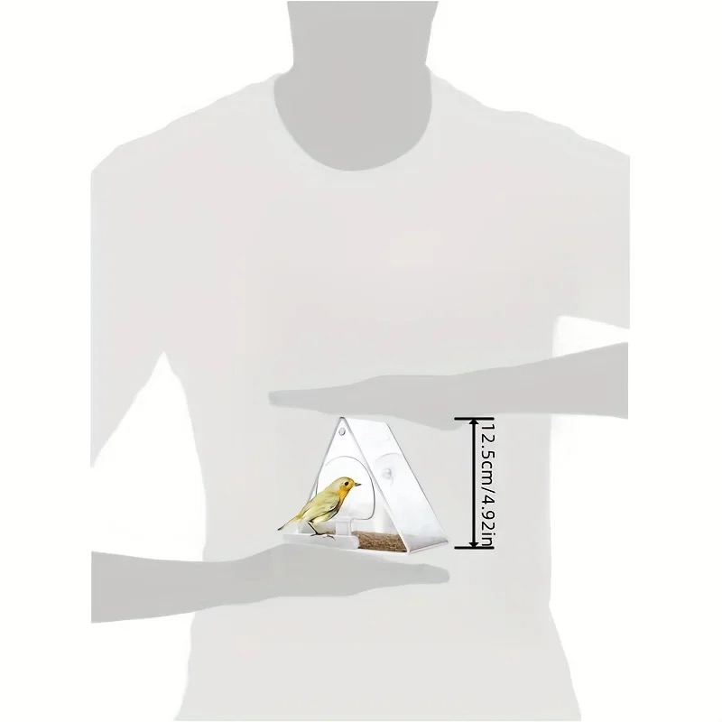 Hand holding a compact bird feeder, showing its real-world size
